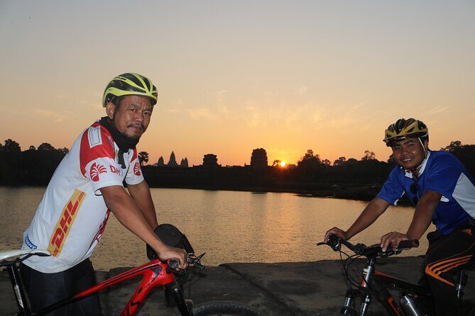 Angkor Sunrise Expedition Cycling Through Serene Backroads - Ta Prohm on the backroads: roots, ruins, and fewer rush vibes