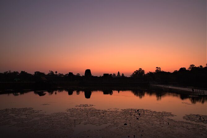 Angkor Sunrise Expedition Cycling Through Serene Backroads - Angkor Thom wall ride: moat side, jungle side, and the satisfying feeling of movement