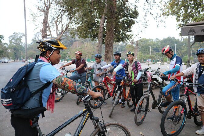 Angkor Sunrise Expedition Cycling Through Serene Backroads - Bayon’s faces and the finish with momentum