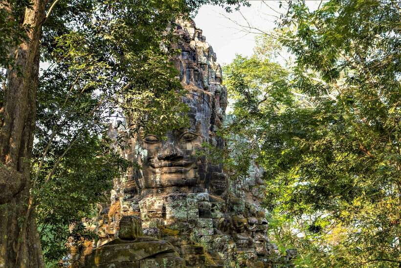 Angkor Wat: and Beyond Sunset at Bakheng Tour - Entering Angkor Wat: moat views, outer wall scale, and carved bas-reliefs