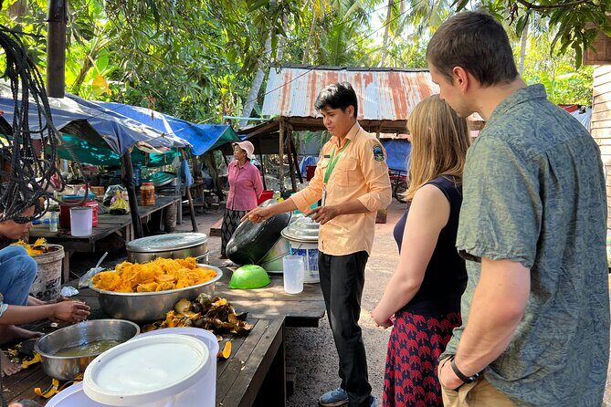 Angkor Wat Sunrise Tour By E-Bike Experience With Breakfast Included - Riding Into Angkor Thom and Then Meeting Bayon’s Smiling Faces