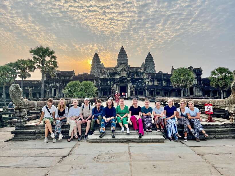 From Siem Reap: Angkor Wat Sunrise and Temples E-Bike Tour - Bayon + Victory Gate of Angkor Thom: smiling faces with context