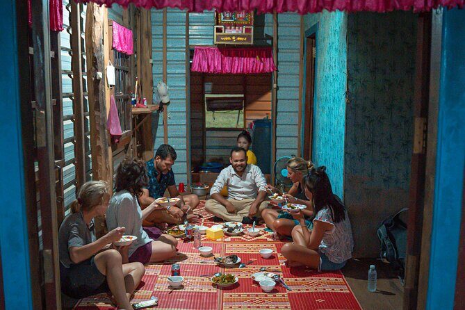 Old Siem Reap Sunset Food Tour by Tuk-tuk - Stop 3 at Phnom Krom: lotus seeds, rice fields, and a meal in a stilted home