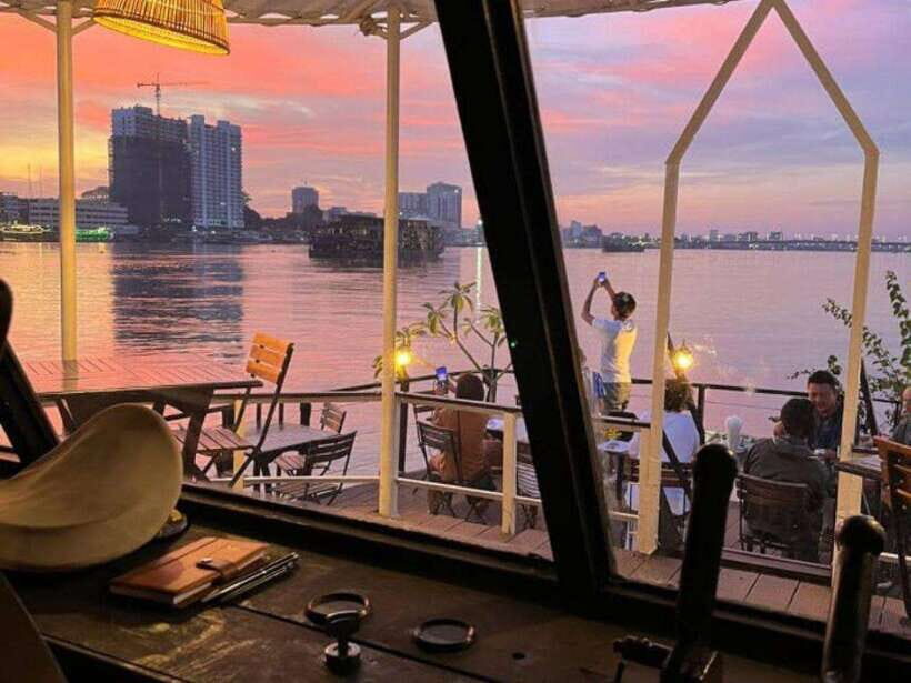 Phnom Penh: Sunset Cruise on Kanika Boat - Phnom Penh from the water: skyline photos and river life
