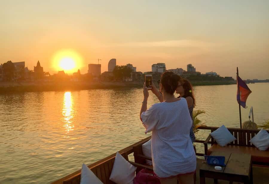 Phnom Penh: Sunset Cruise with Unlimited Beer &Fruit platter - Landmarks From the Water: Royal Palace, Bridges, and Big Government Buildings