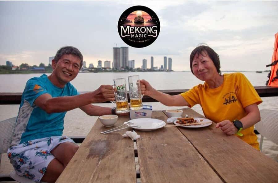 Phnom Penh: Sunset Cruise with Unlimited Beers & BBQ Buffet - Getting Your Bearings: Diamond Island and the Flag Photo Moment
