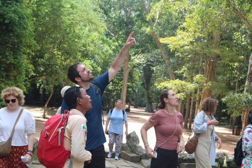 Siem Reap: Angkor Wat with German or English Guided Tour - Bayon Temple Face Towers: Reading the Fortified City Up Close