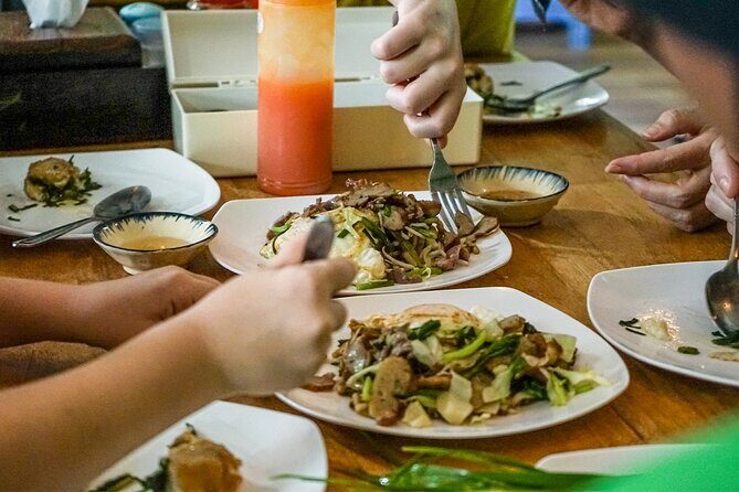 Siem Reap Evening Food Tour - Inclusive 5 stops Local Tastings - Stop Four: Street 60 night market with chicken, insects, and mattress-seat dining
