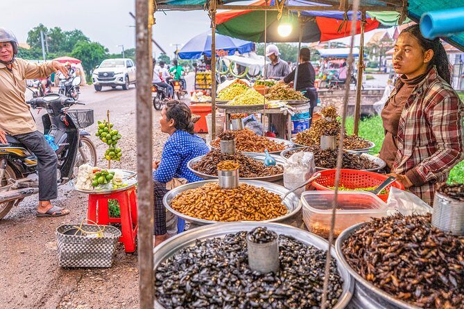 Siem Reap Evening Foodie Vespa Tour / Tuk Tuk Available - Stop 4: Road 60 Field and the night market eating energy