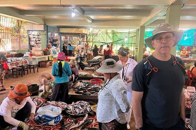 Siem Reap: Morning Bike Tours with Local Market & Lunch - Buddhist temple blessing from a monk: respectful and calm