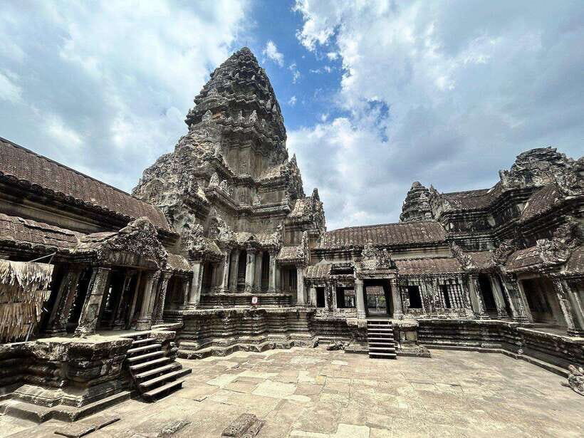 Small-Group Full Day Angkor wat Guide tour with Sun set - Angkor Thom and Bayon: southern gate faces and the calm center
